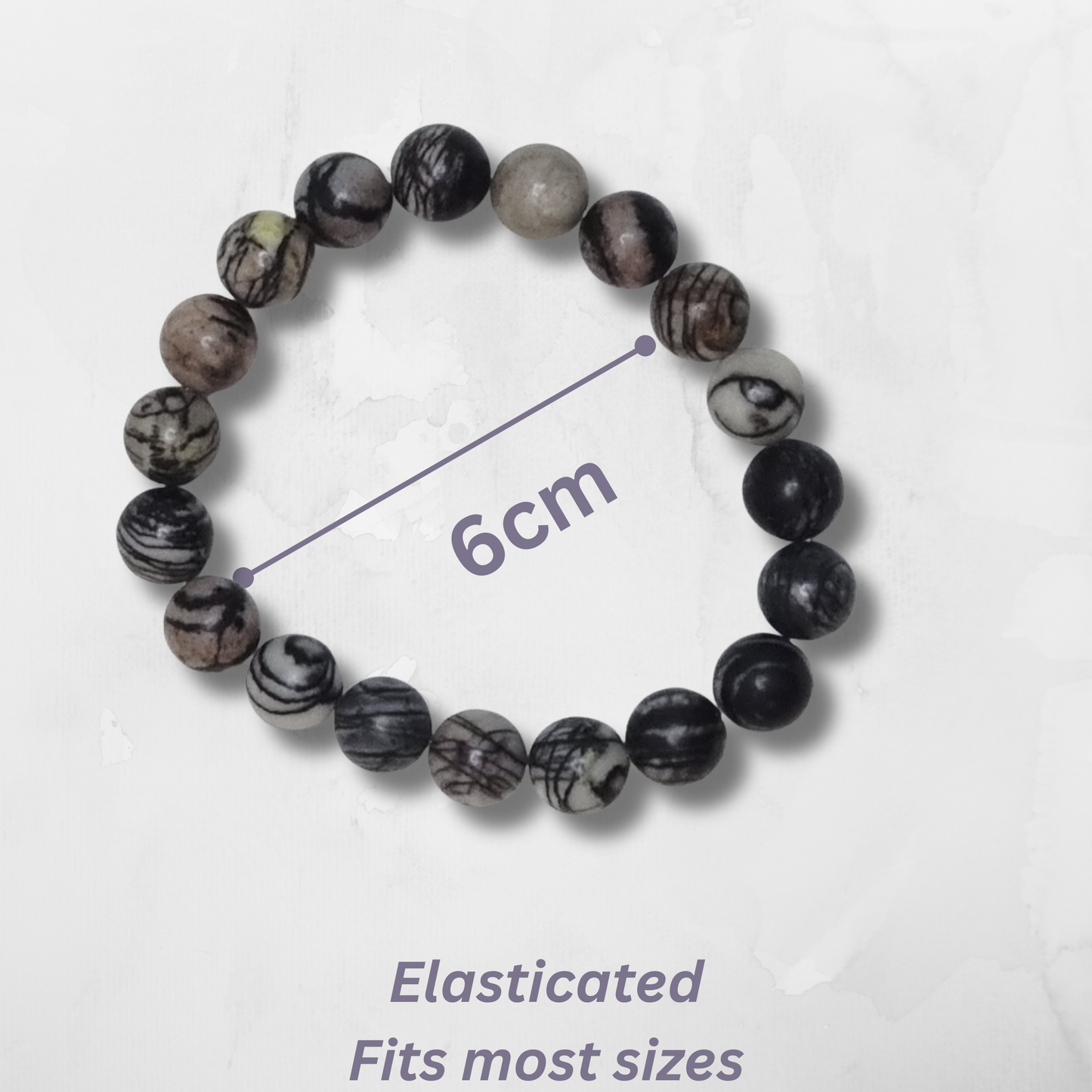 Elasticated beaded bracelet with measurement on a white background