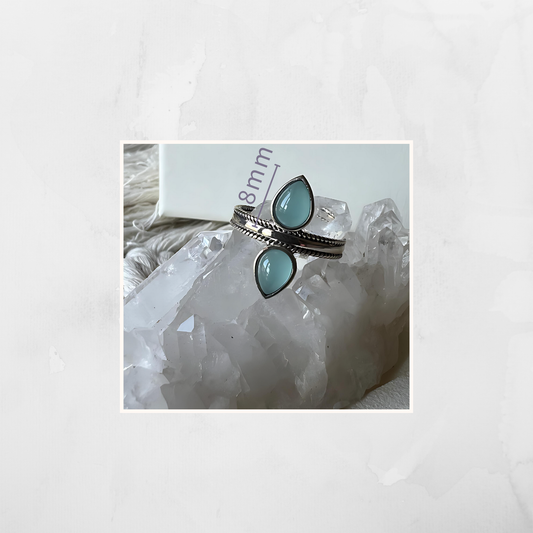 Blue Chalcedony Double Ring, a serene statement piece set in genuine 925 sterling silver. Known for its peaceful and nurturing energy, blue chalcedony promotes self-awareness, emotional balance, and inner peace.