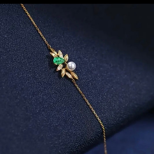 Where sparkle meets grace, this Gold-Plated Sterling Silver Bracelet is a celebration of timeless beauty and modern elegance. Crafted from genuine .925 sterling silver with radiant gold plating, it features a refined combination of cubic zirconia accents and synthetic pearls—balancing shimmer and softness in perfect harmony.