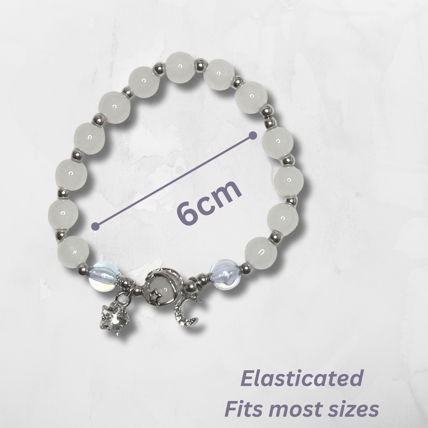 Channel celestial energy and gentle inspiration with our Opal Tumblestone Bracelet, adorned with delicate moon and star pendants. Opal is a stone of intuition, emotional balance, and inner light, known to inspire creativity and enhance spiritual awareness.
