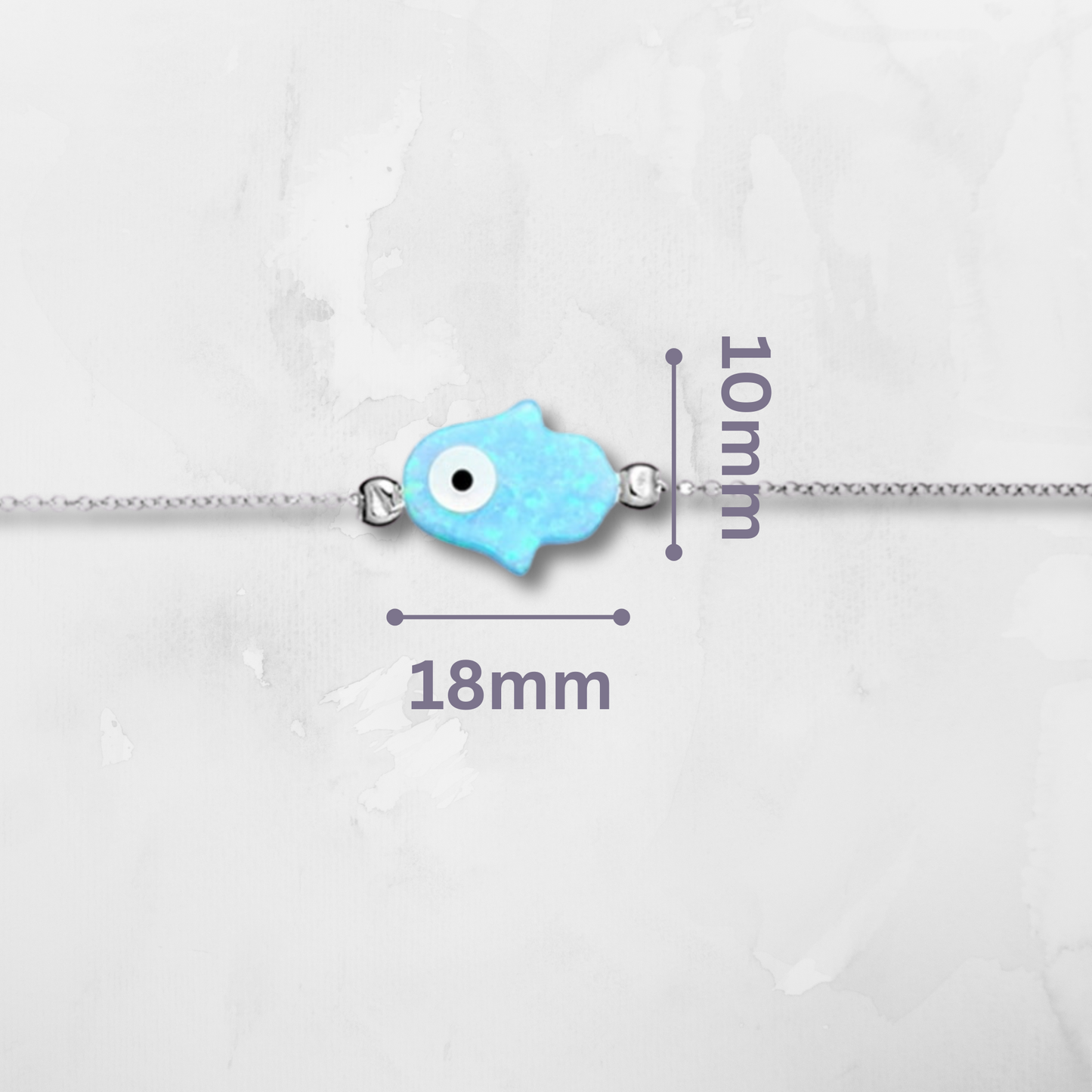 Sterling Silver Hamsa & Evil Eye Bracelet, thoughtfully designed with luminous light blue opalite and two powerful symbols of spiritual energy. The Hamsa hand represents blessings and defense, while the Evil Eye wards off negativity