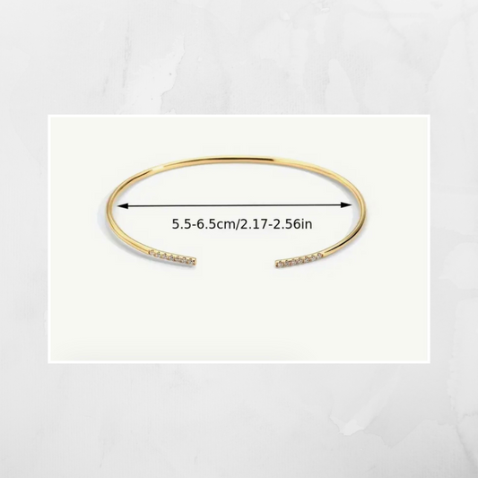 Material: 925 Sterling Silver with black CZ stones
Style: Minimalist, stackable, adjustable bangle
Features: Hypoallergenic and tarnish-resistant