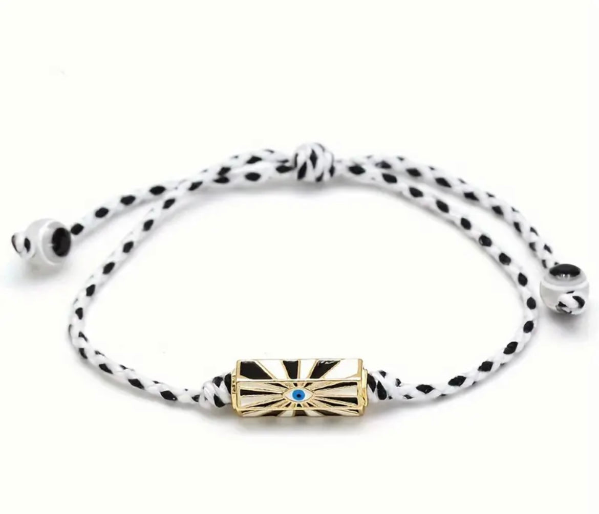 Add a bohemian touch to your look with our Boho Braided Eye Rope Bracelet—a playful, quirky piece designed to turn heads. Featuring a bold eye motif and available in four beautiful colours, this adjustable bracelet is the perfect way to express your unique style (and keep all eyes on you 👁️).