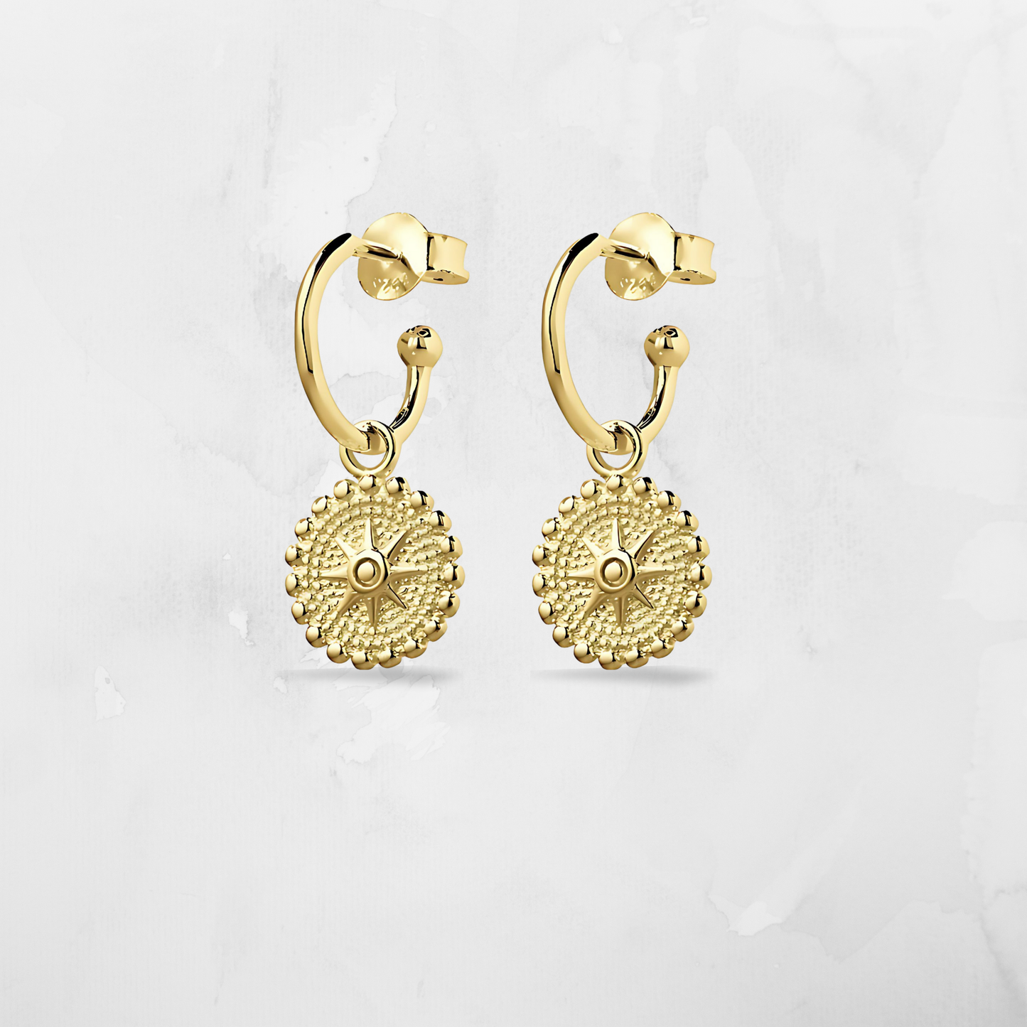 Add some star power to your outfit with our Half Hoop Circular Star Earrings. Crafted in radiant 14K gold plating, these earrings feature a bold circular hoop design anchored by a polished star charm—perfect for adding a little glamour and shine to any look.

Lightweight and comfortable with a butterfly back, they’re ideal for dressing up, everyday sparkle, or gifting with meaning.