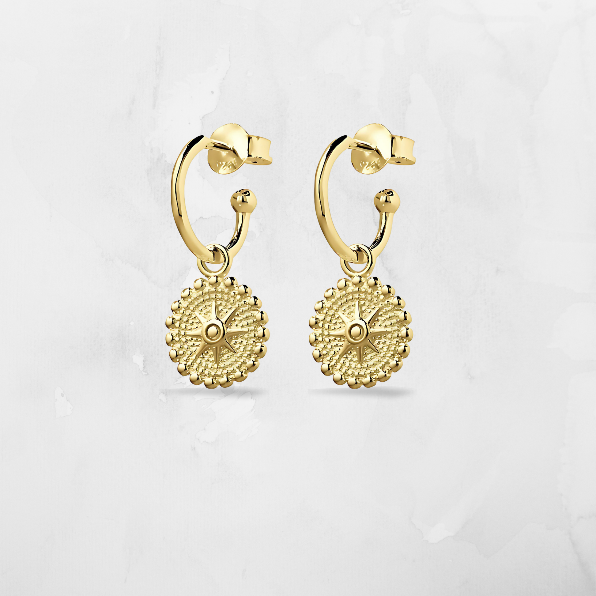 Add some star power to your outfit with our Half Hoop Circular Star Earrings. Crafted in radiant 14K gold plating, these earrings feature a bold circular hoop design anchored by a polished star charm—perfect for adding a little glamour and shine to any look.

Lightweight and comfortable with a butterfly back, they’re ideal for dressing up, everyday sparkle, or gifting with meaning.