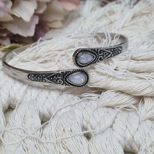 Adjustable silver cuff bracelet with two teardrop opal stones and vintage detailing