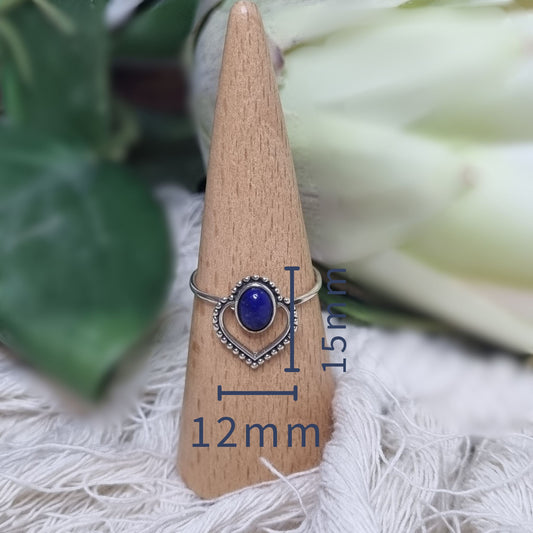 Close-up of lapis lazuli heart ring with front face measured in millimeters for size reference