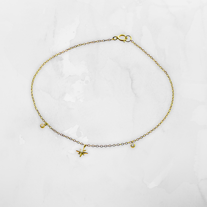 North Star and Charms Anklet, a delicate yet meaningful piece crafted in 14K gold-plated sterling silver