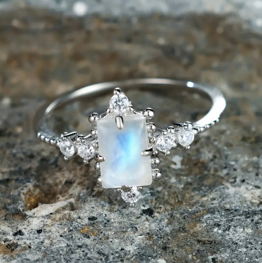 Embrace new beginnings with our stunning Silver Moonstone Ring, designed to symbolize light, clarity, and feminine strength. At its center is a luminous moonstone gemstone, surrounded by sparkling cubic zirconia that enhances its ethereal beauty.