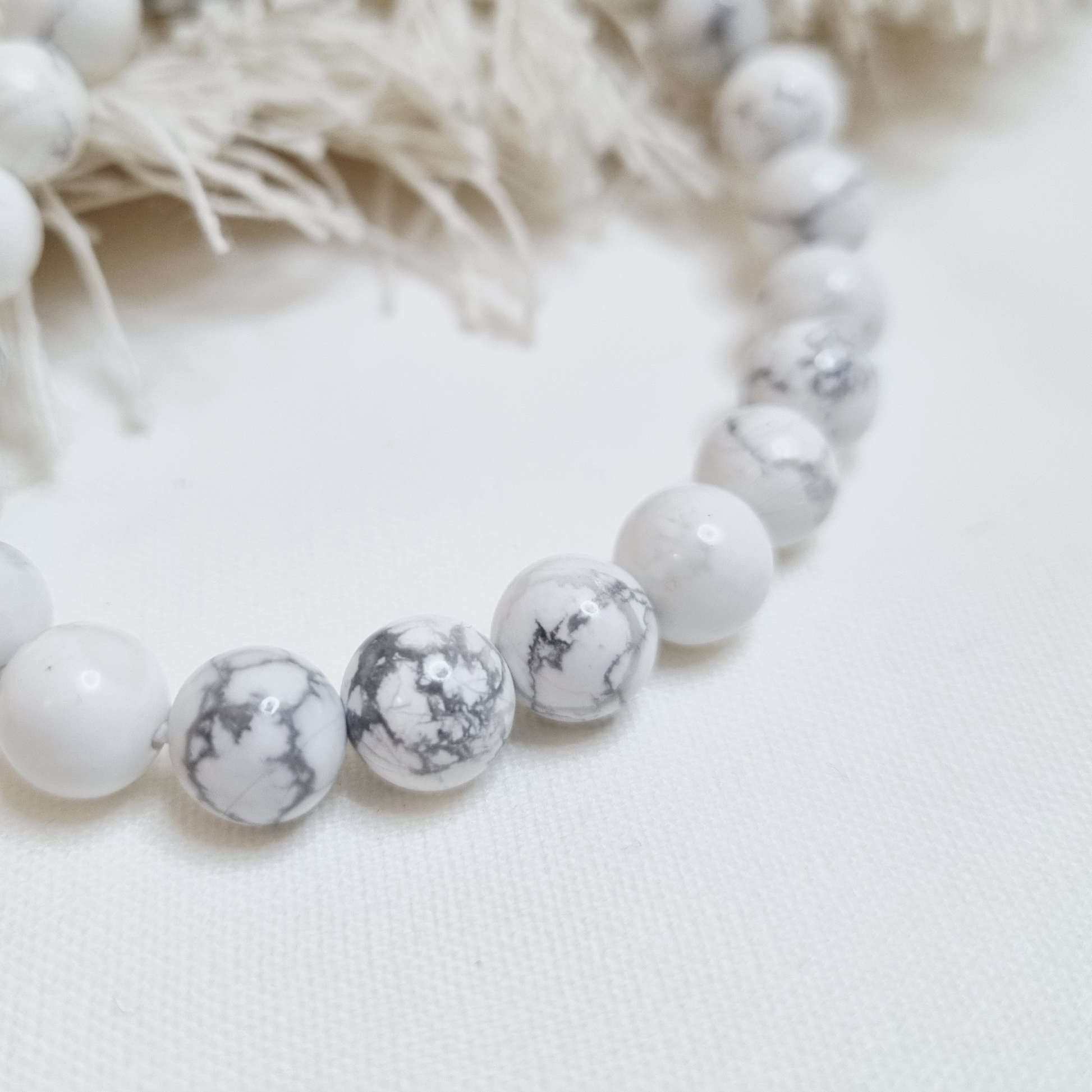 Soothe your mind and spirit with the serene energy of our White Howlite Tumblestone Bracelet