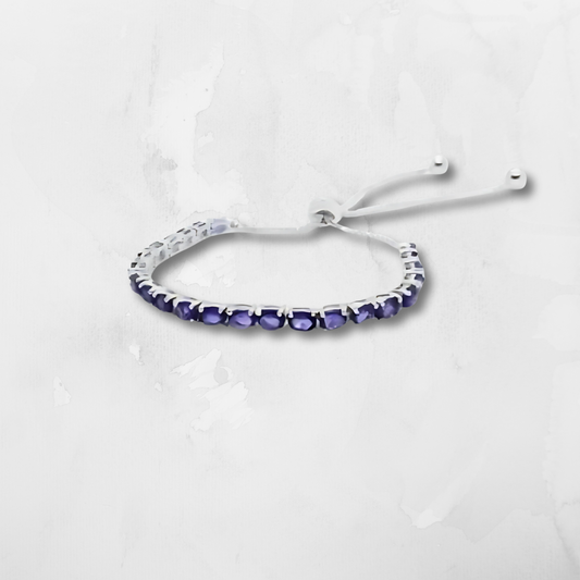 Amethyst Lariat Bracelet, crafted from 925 sterling silver and finished with a polished lariat-style chain. Featuring a genuine amethyst gemstone, this bracelet is known for its ability to promote calm, clarity, and spiritual balance.