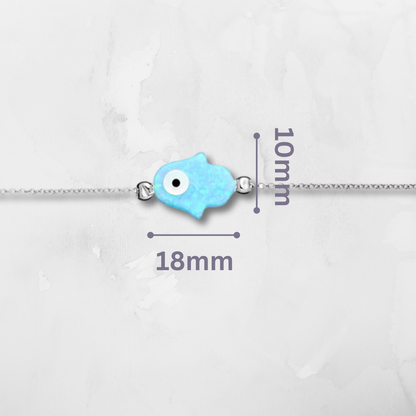 Sterling Silver Hamsa & Evil Eye Bracelet, thoughtfully designed with luminous light blue opalite and two powerful symbols of spiritual energy. The Hamsa hand represents blessings and defense, while the Evil Eye wards off negativity