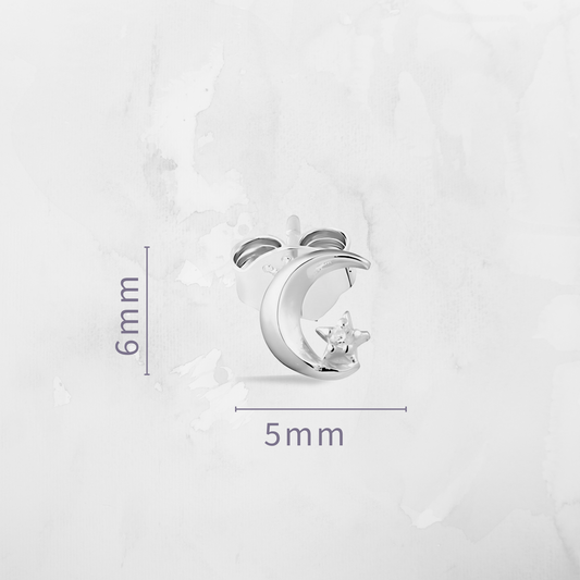 Enhance your celestial style with our Moon & CZ Star Stud Earrings—a perfect pairing of elegance and cosmic charm. Crafted with shimmering cubic zirconia and a delicate moon detail, these earrings add subtle sparkle and balance to any outfit.