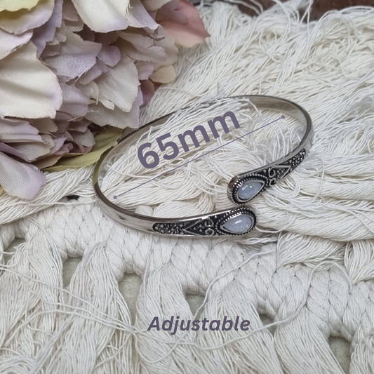 Adjustable opal bangle bracelet with 65mm width shown with measurement