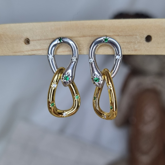 two-tone linked drop earrings, featuring a modern sculptural design in sterling silver and gold-plated finish. 
